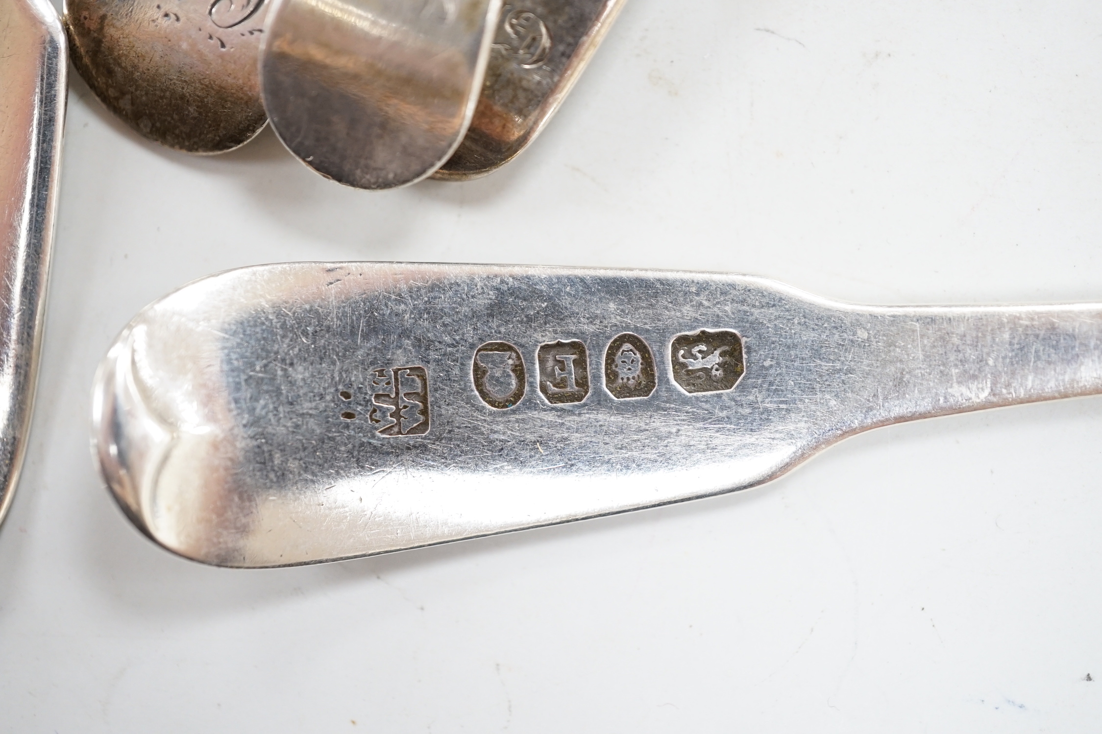 A George III silver Old English feather edge dessert spoon, London, 1775 and a small quantity of assorted mainly 19th century silver flatware including an Irish table fork, various patterns, makers and dates, 18.5oz.